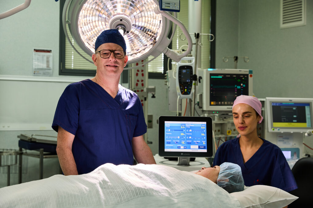 Cabrini theatre with a surgeon and nurse