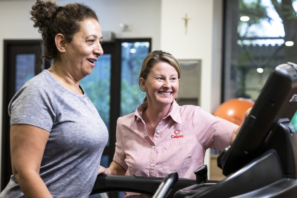 Cabrini patient on walking machine