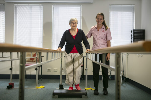 Allied Health physiotherapist with patient