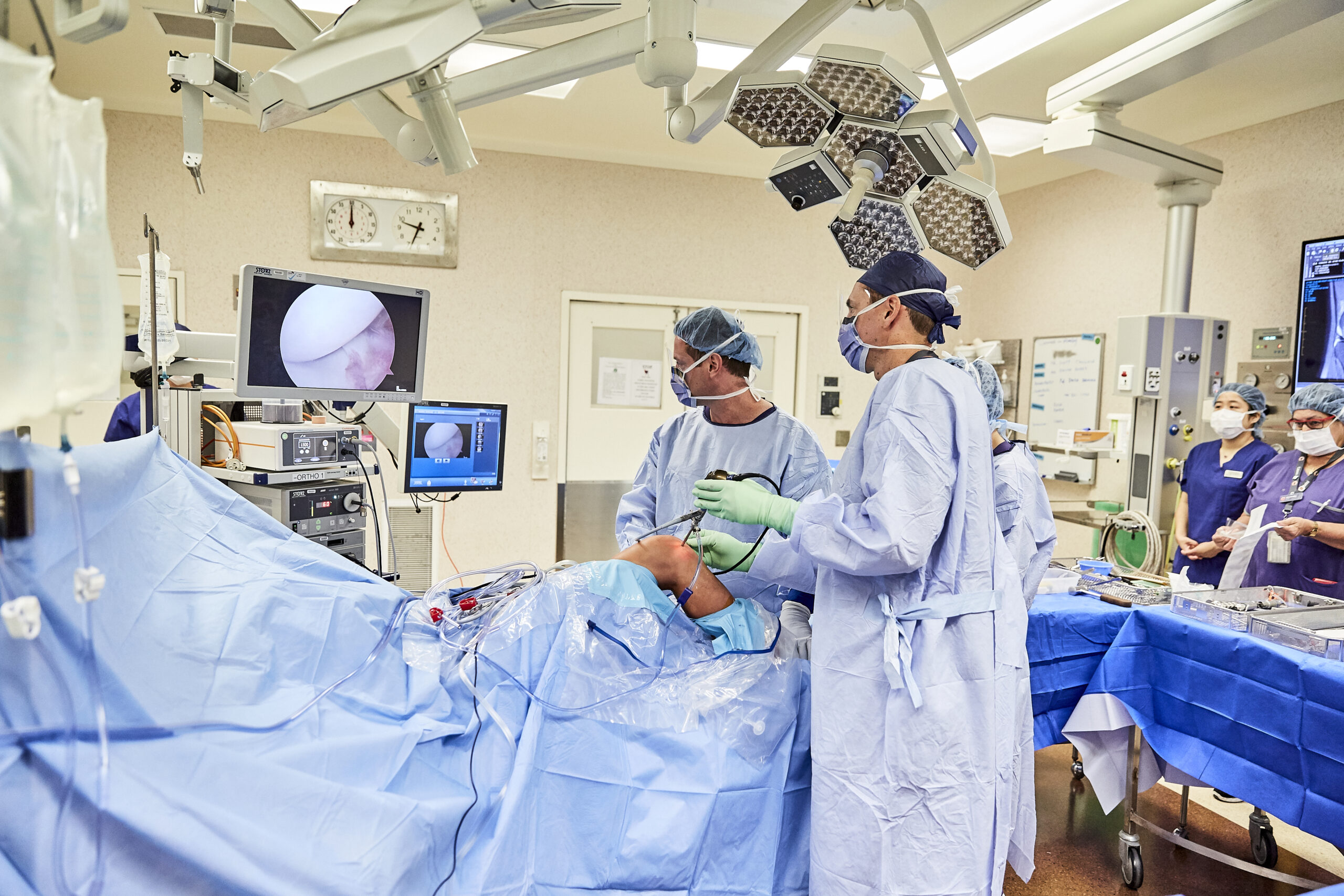 Surgeon performs a laparoscopic ACL repair operation