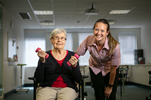 Cabrini pulmonary patient with staff in rehab