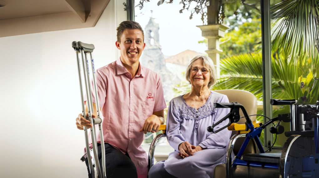 Female hip replacement patient with male physiotherapist