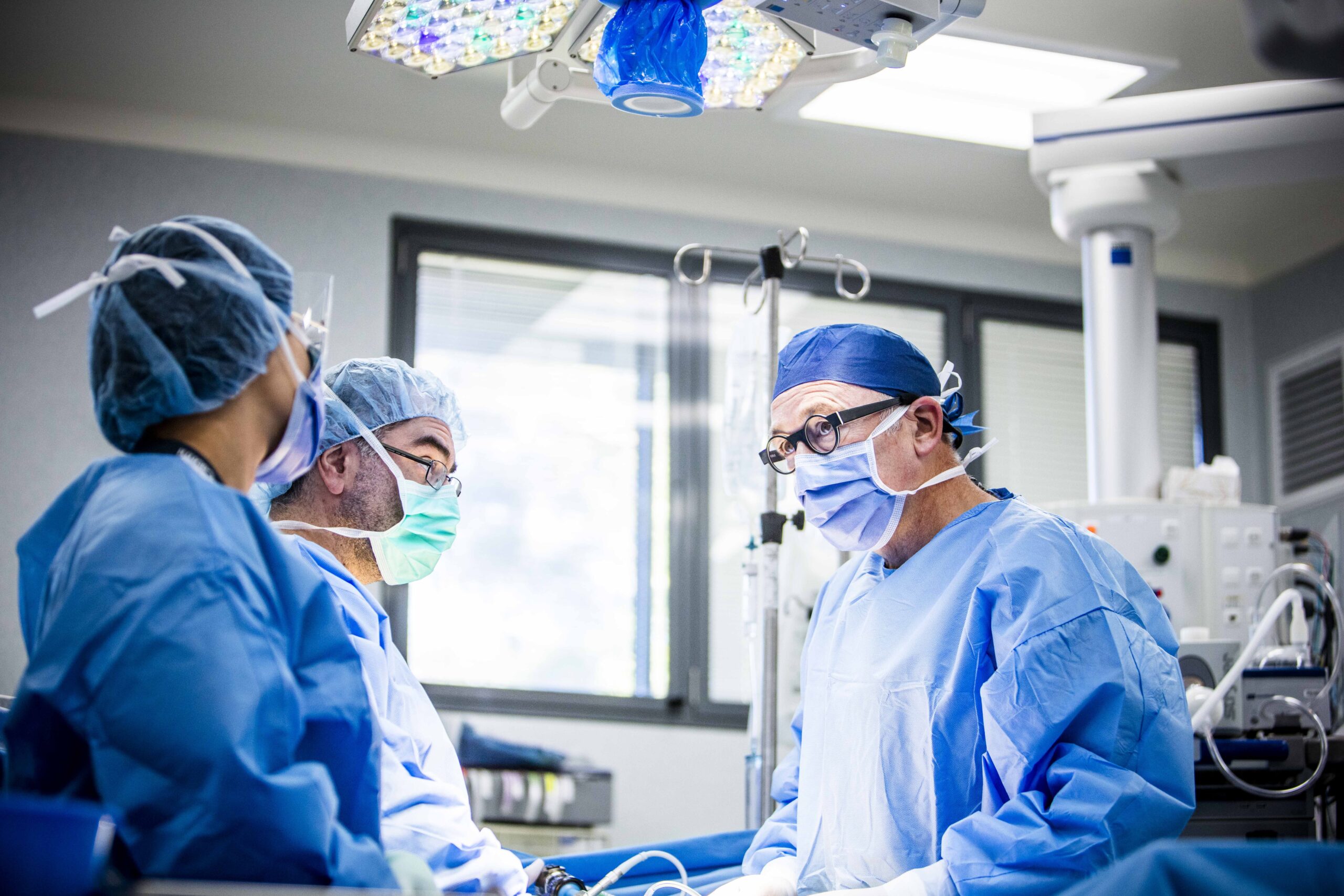 surgeons prepare to conduct a tonsillectomy