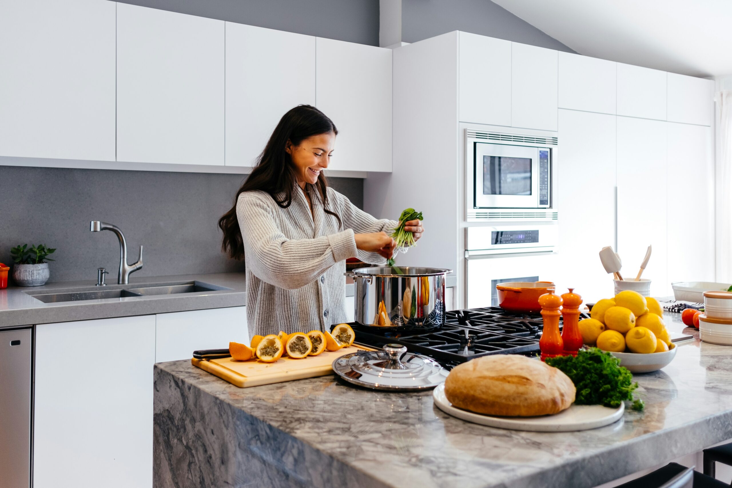 Lady preparing dinner at the kitchen bench