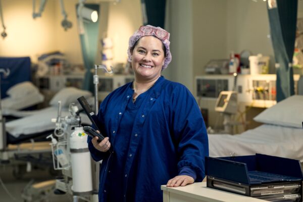 a perioperative nurse waits to greet a patient
